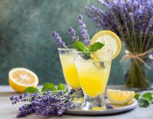 lavender moringa kombucha mocktail with fresh lavender mint and lemon on cocktail tray