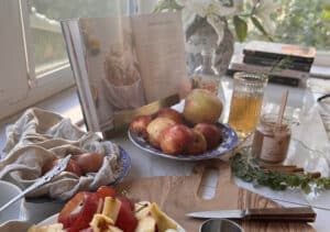 apple peels in bowl next to baking apple pie