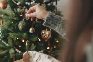 hanging ornaments on a Christmas tree